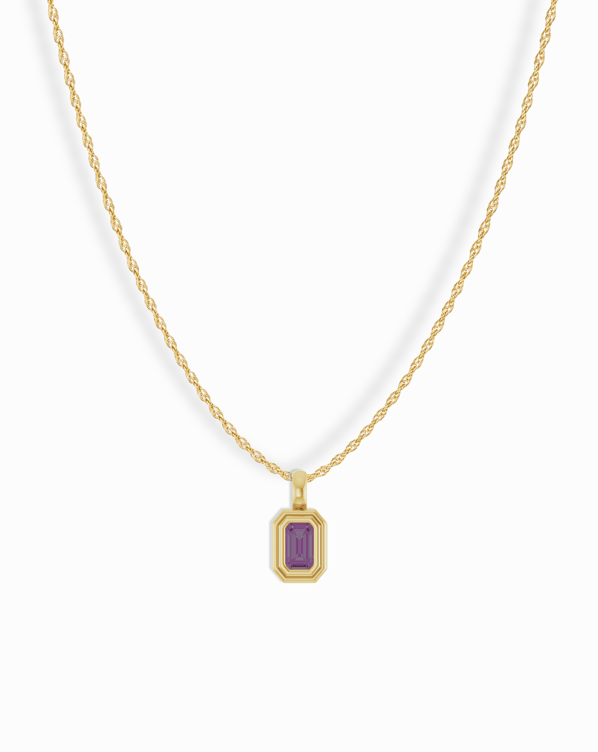A Mod + Jo 14k Birthstone Pendant Necklace featuring a rectangular purple gemstone in a layered gold setting on a thin rope chain.
