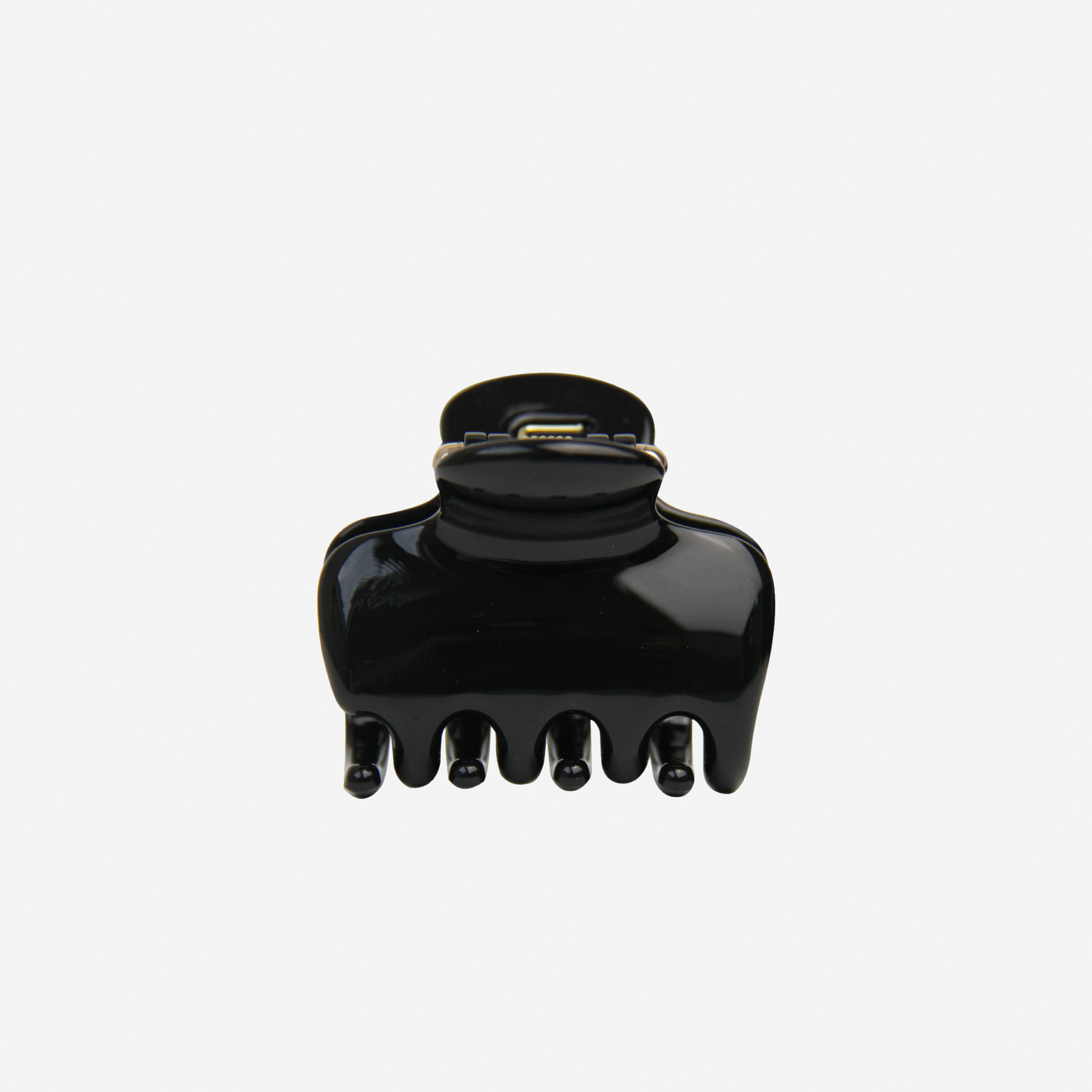The BRAID & BOW Medium Black Swirl Hair Claw, made from black plastic with five prongs, is featured against a plain white background. This chic hair accessory provides a strong, secure hold for everyday styling.