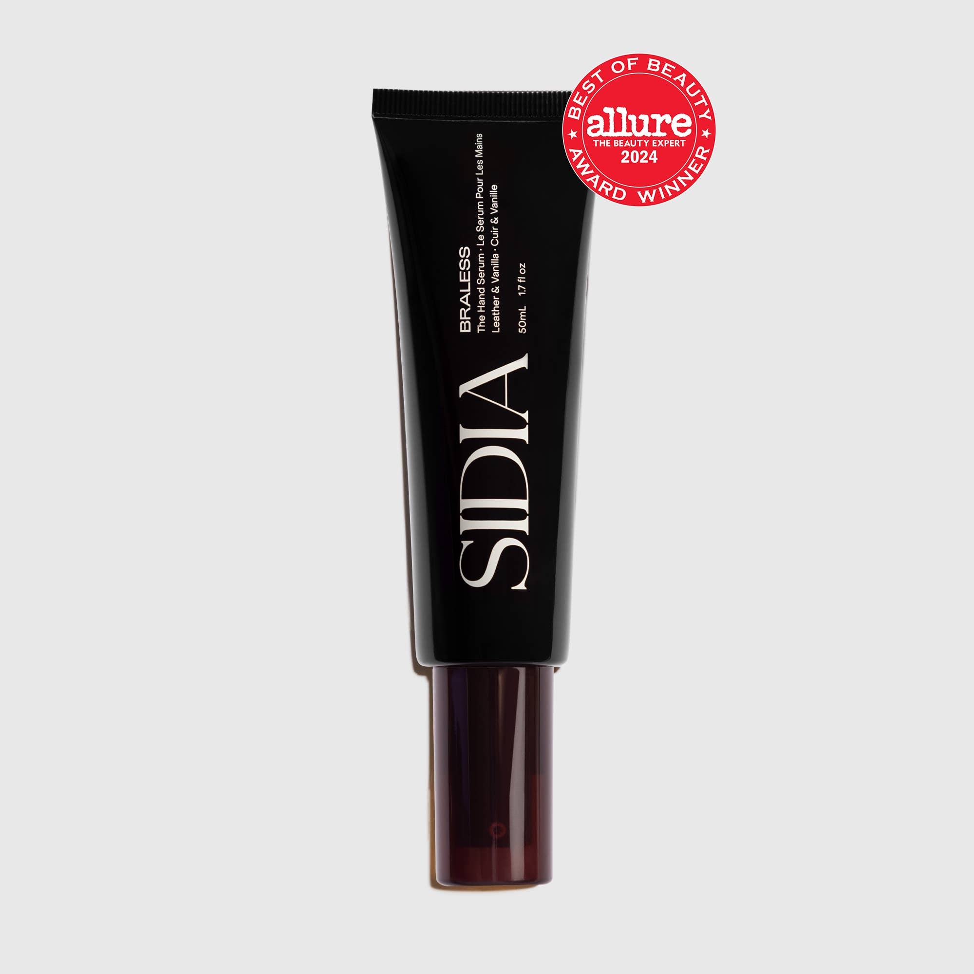 A black tube of The Hand Serum by SIDIA with a dark cap, displaying a red Allure Best of Beauty Award Winner 2024 badge in the top right corner, set against a light gray background.