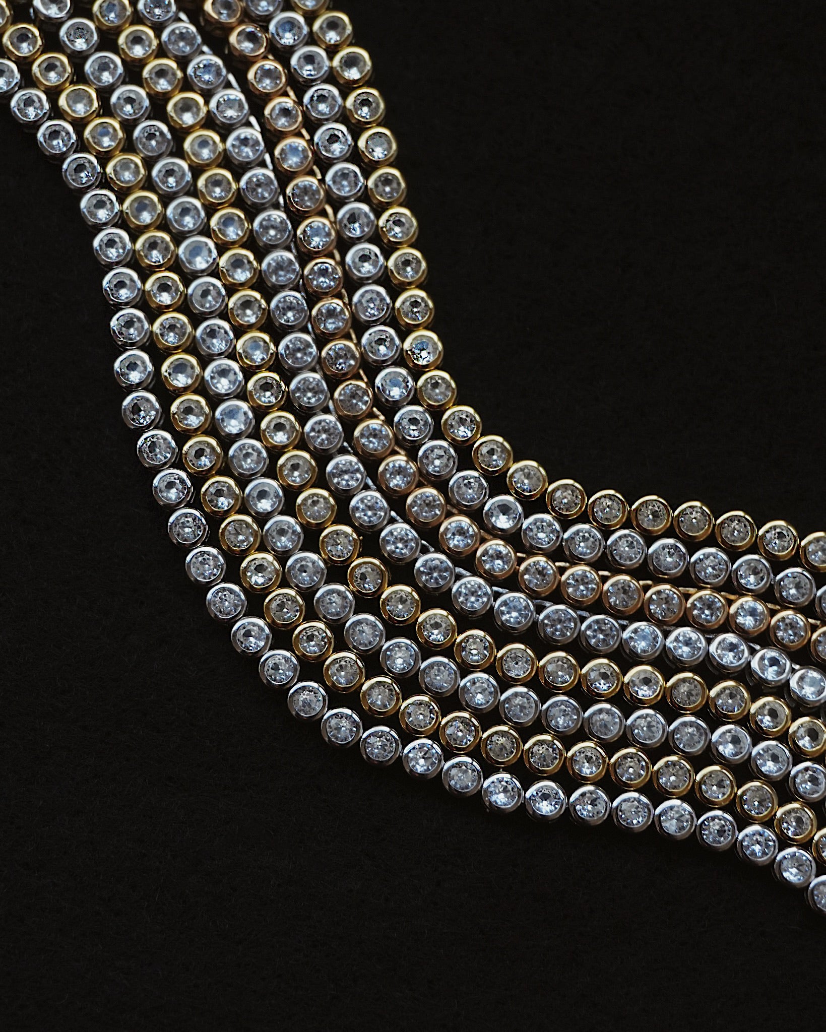 Close-up of a diamond necklace on a black background