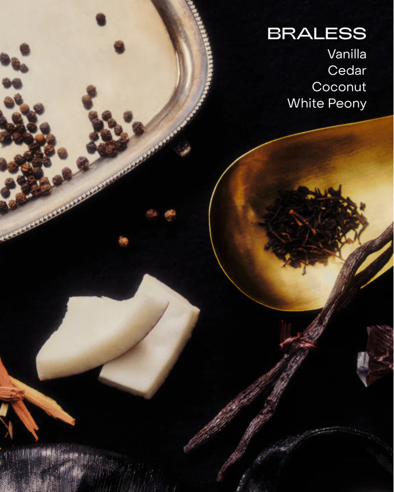 Spices and vanilla beans on a dark surface with &#39;BRALESS&#39; branding.