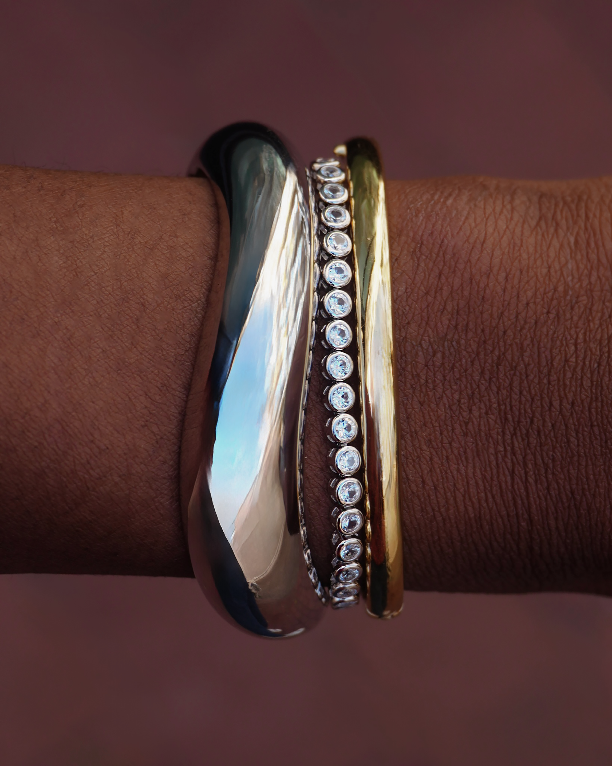 Emma Bezel Tennis Bracelet on wrist, showcasing the stylish gold, silver, and gemstone design.