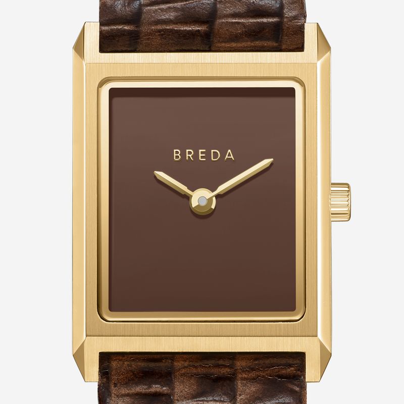 The Virgil Watch Small (Lizard Embossed) by Breda features a rectangular 18K gold-plated case, brown textured leather band, minimalist brown face with gold hands, and BREDA branding at the top. No hour markers for a sleek look.