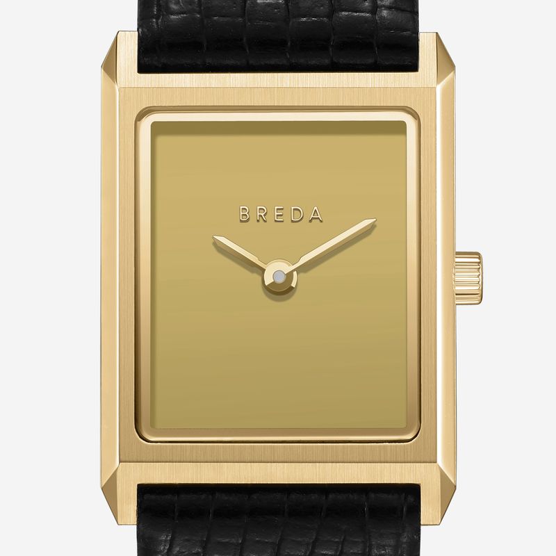 The Virgil Watch Small (Lizard Embossed) by Breda is a rectangular gold watch with a minimalist, vintage look. It features a gold dial without numbers, the BREDA logo at center, gold hands, and a black lizard-embossed leather band.