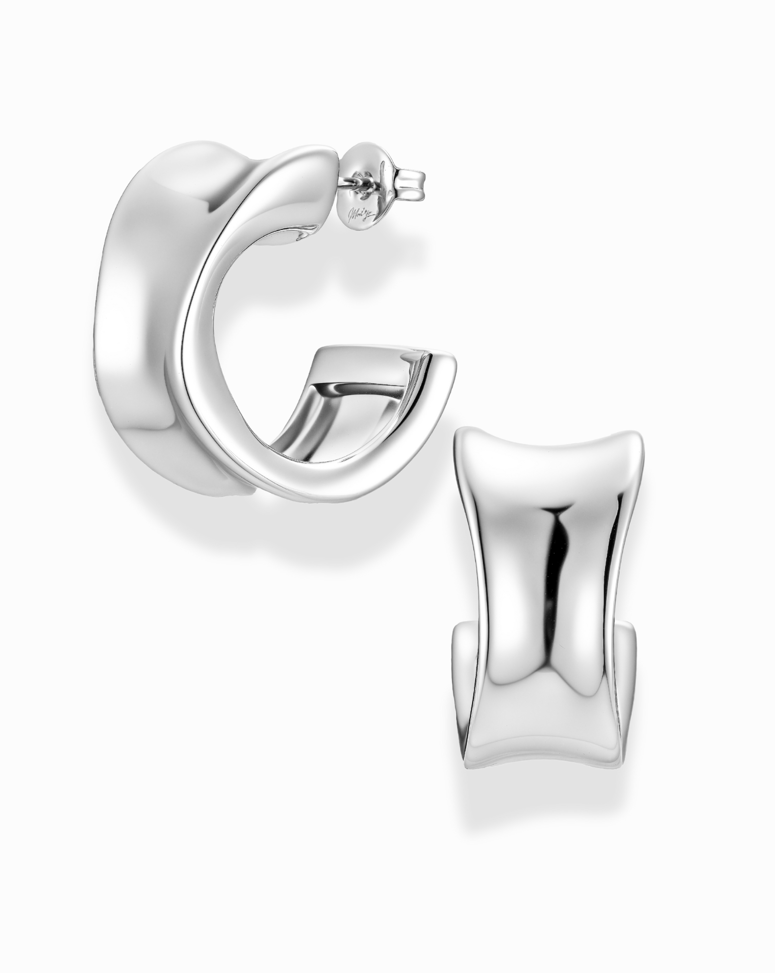 silver, wide, and inverted curve earrings on a white background