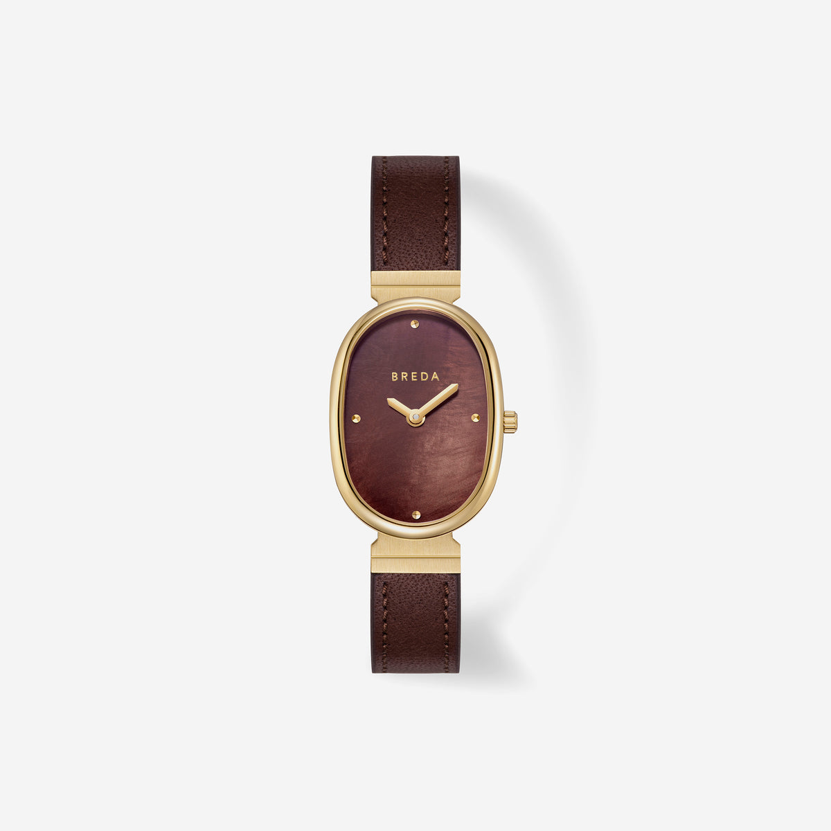 A Jane (Leather) by BREDA wristwatch by Breda, featuring a gold-plated stainless steel oval case, a burgundy dial with minimal gold markings, and a dark brown leather strap, displayed on a white background.
