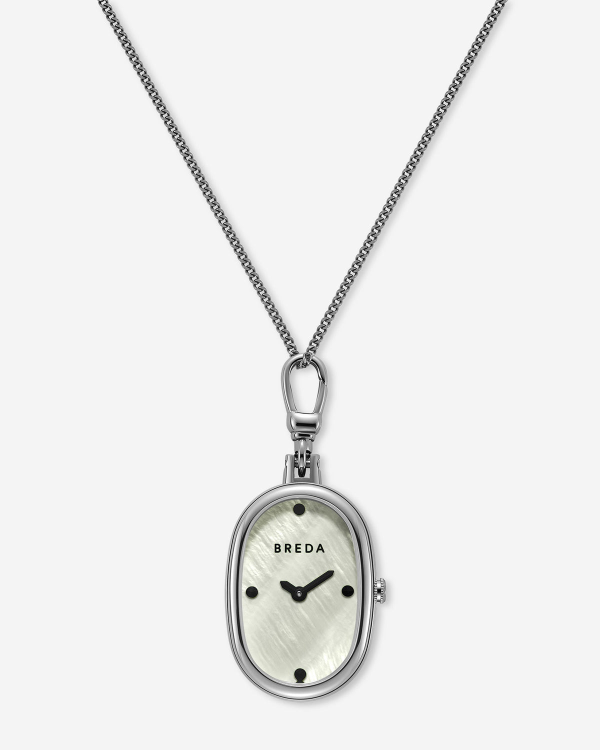 The Jane Time Charm by BREDA features a silver oval pendant watch with a minimalist face, black hour markers, and the BREDA logo, elegantly suspended from a thin silver chain against a white background—this versatile piece adds understated timekeeping charm to any ensemble.