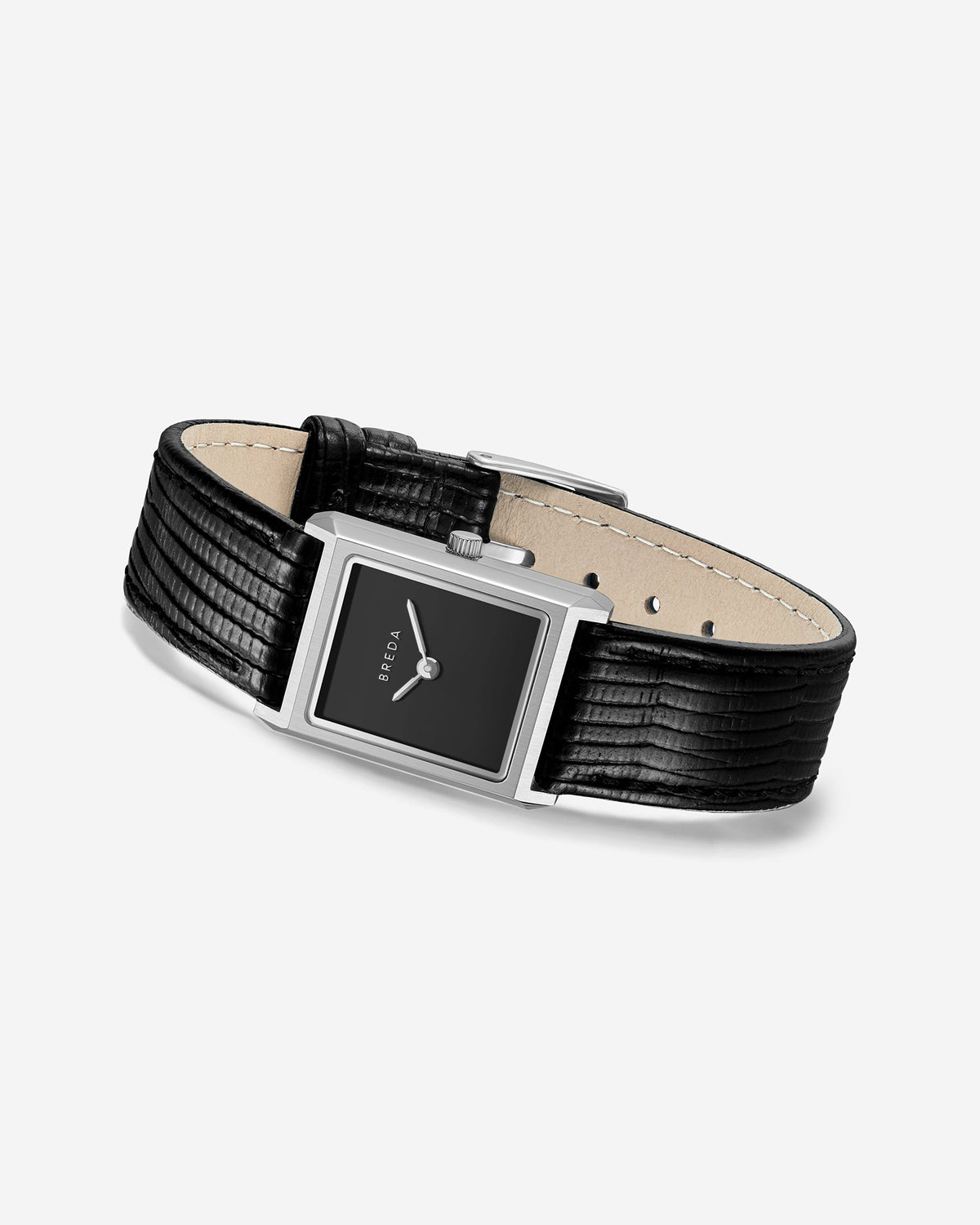 The Virgil Watch Small (Lizard Embossed) by BREDA is a rectangular stainless steel watch with a black face and a textured genuine leather band.