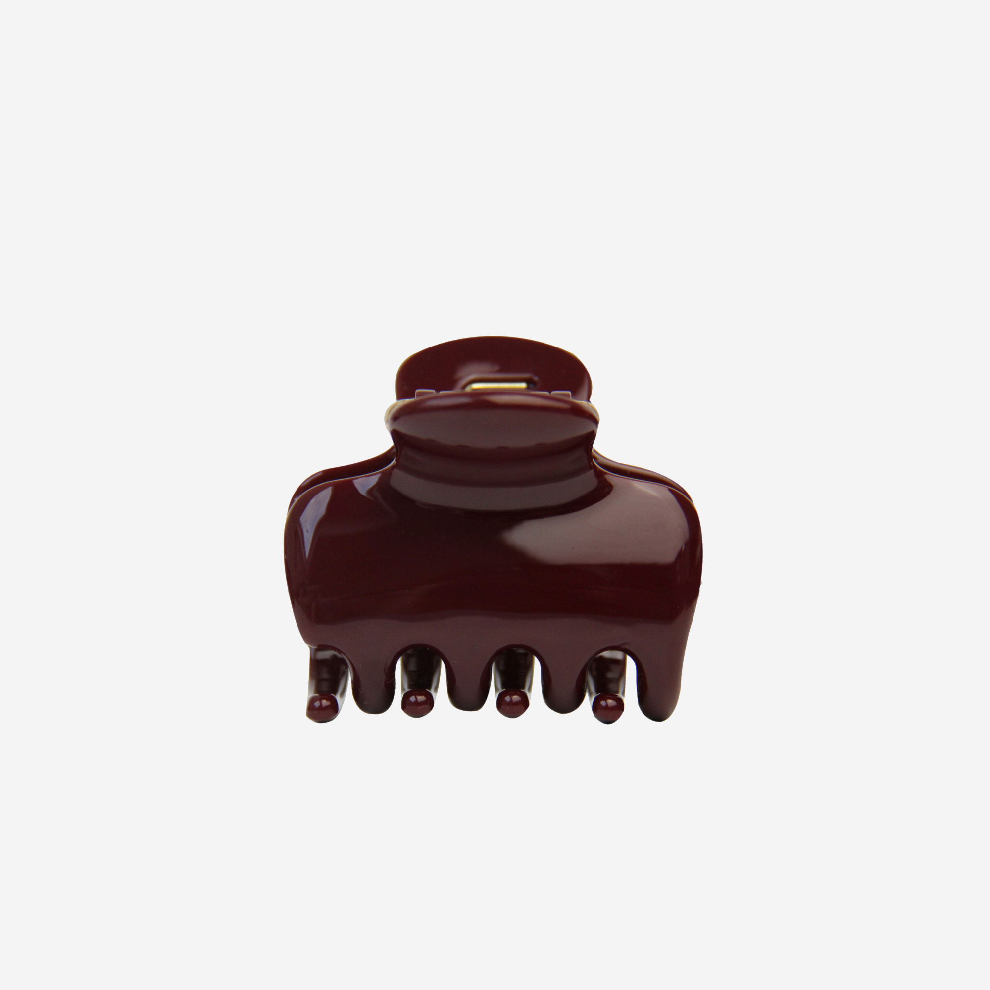 The BRAID & BOW Medium Burgundy Swirl Hair Claw is a stylish, dark maroon hair accessory with a glossy finish and five rounded teeth for a secure hold, beautifully presented against a plain white background.