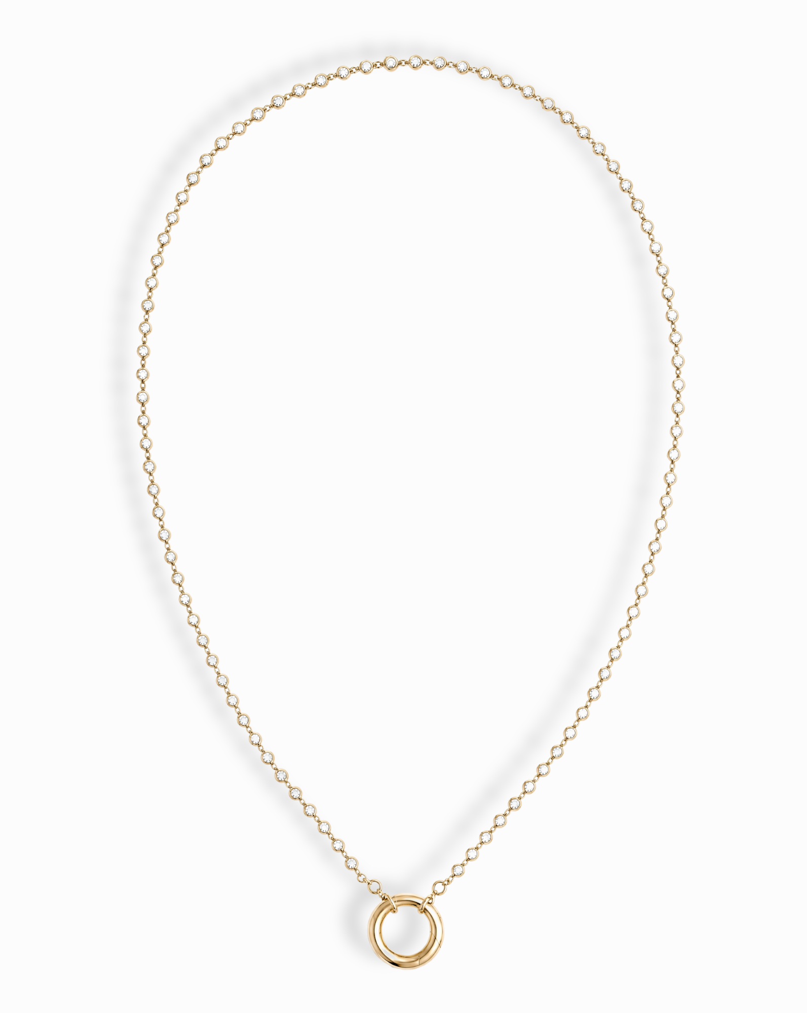 The Callum Tennis Charm Clip Necklace by Mod + Jo features a dainty gold-plated chain with a small circular pendant, elegantly displayed on a white background.
