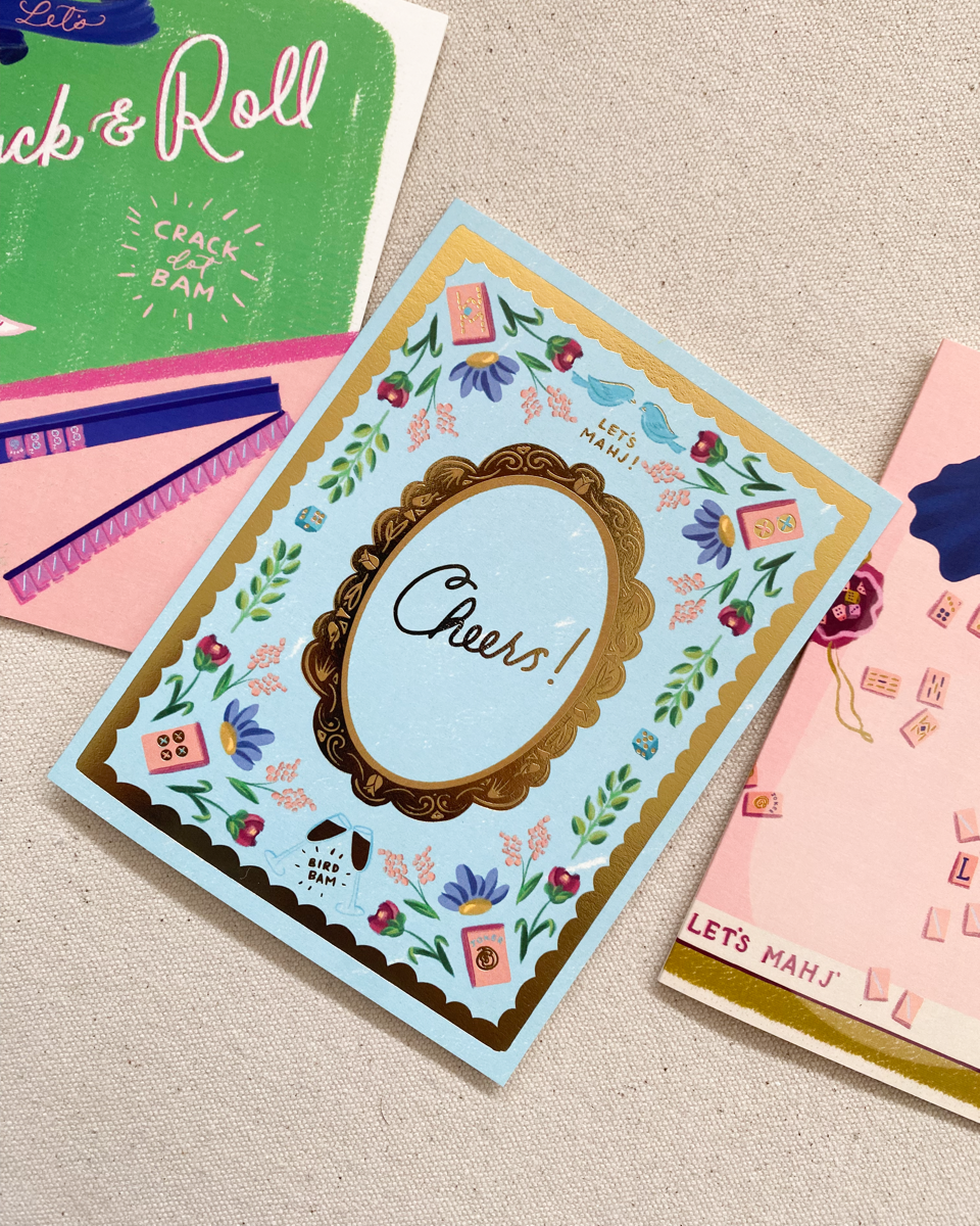 Collection of greeting cards with various designs on a textured surface
