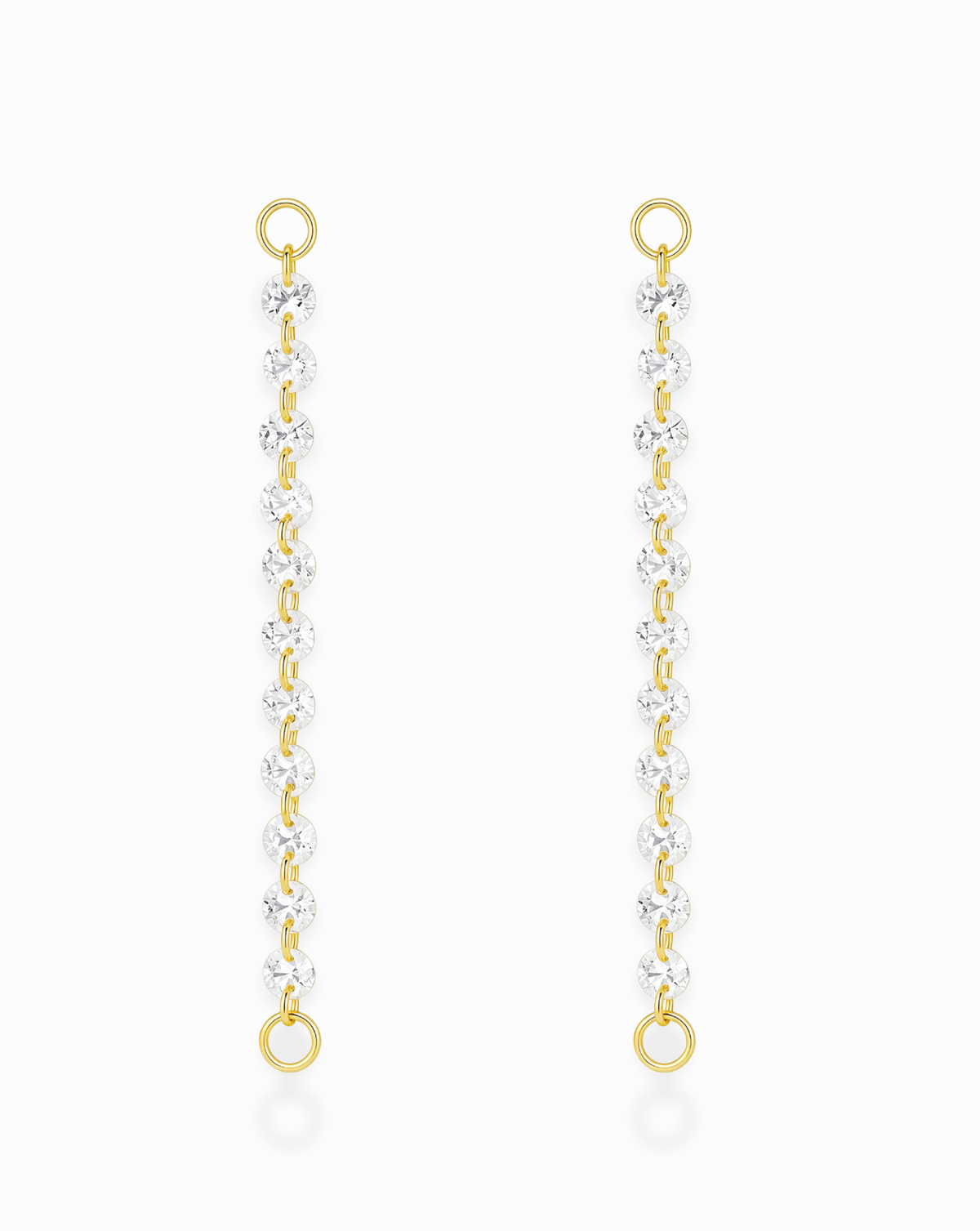 Iris Sapphire Earring Charms by Mod + Jo, consisting of two gold-plated hoop chains featuring a vertical row of lab-grown white sapphires, each with a small gold ring at both ends.