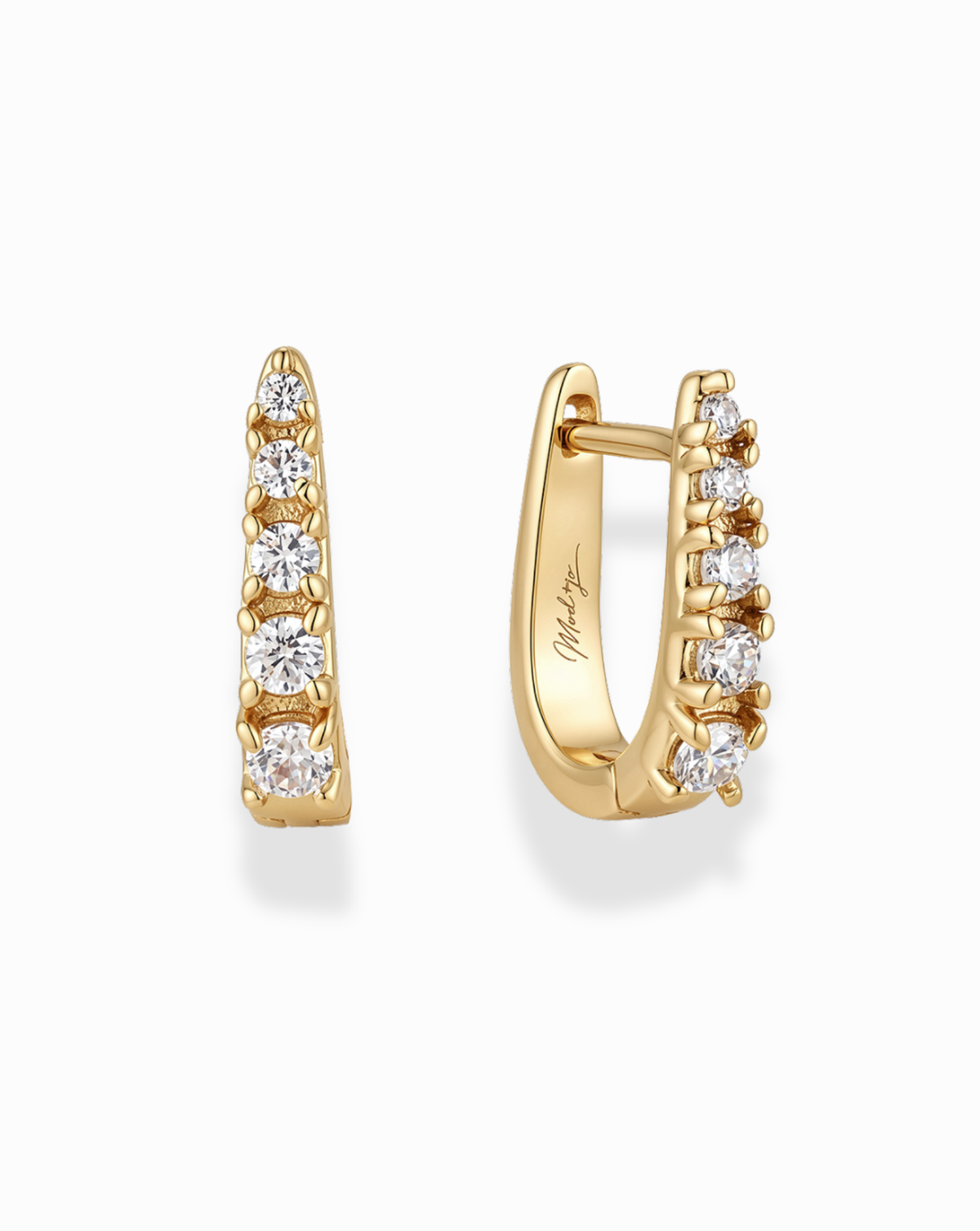 Jules Medium Huggies are a pair of 14k gold-plated huggie hoop earrings, each set with five graduated round-cut cubic zirconia stones.