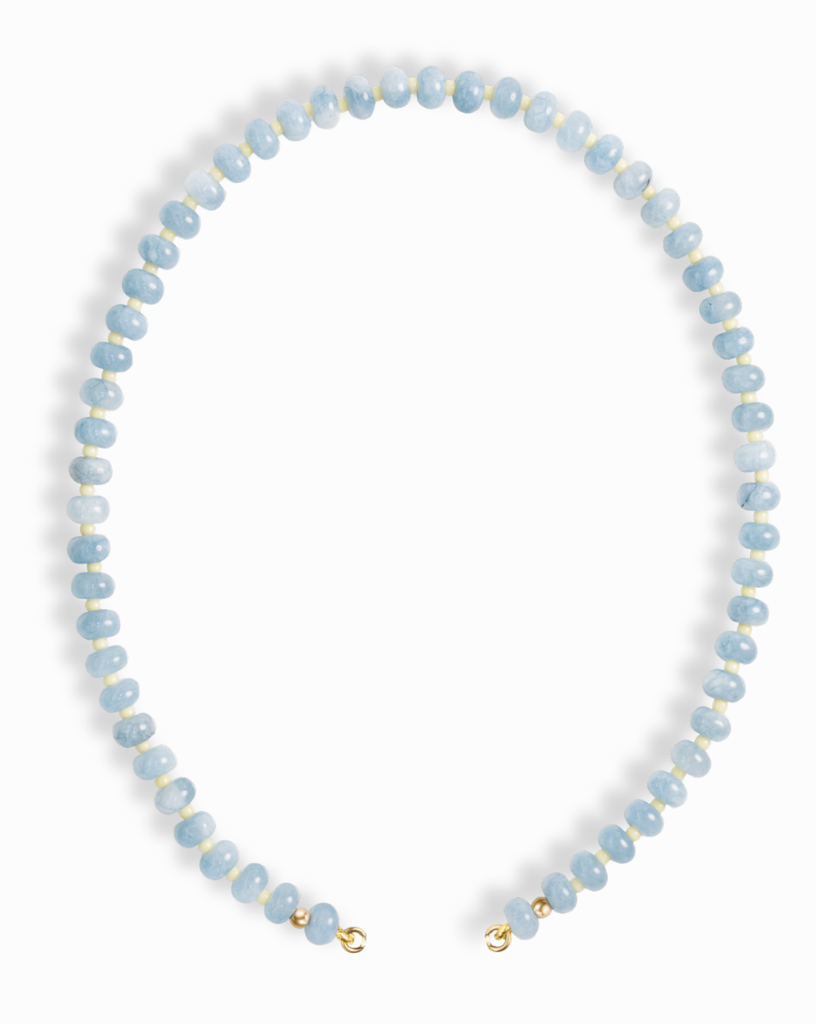 The Macey Gemstone Necklace by Mod + Jo features round, light blue beads with white marbling, strung in a single strand and finished with small gold clasps.
