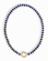 The Mod + Jo Macey Gemstone Necklace features round blue and gold-flecked lapis lazuli beads in a single strand, finished with a statement circular gold clasp at the center—all set against a white background.