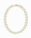 The Portia Gemstone Necklace by Mod + Jo features round, off-white pearl beads and a 14k gold-plated clasp, arranged in an oval shape on a white background.
