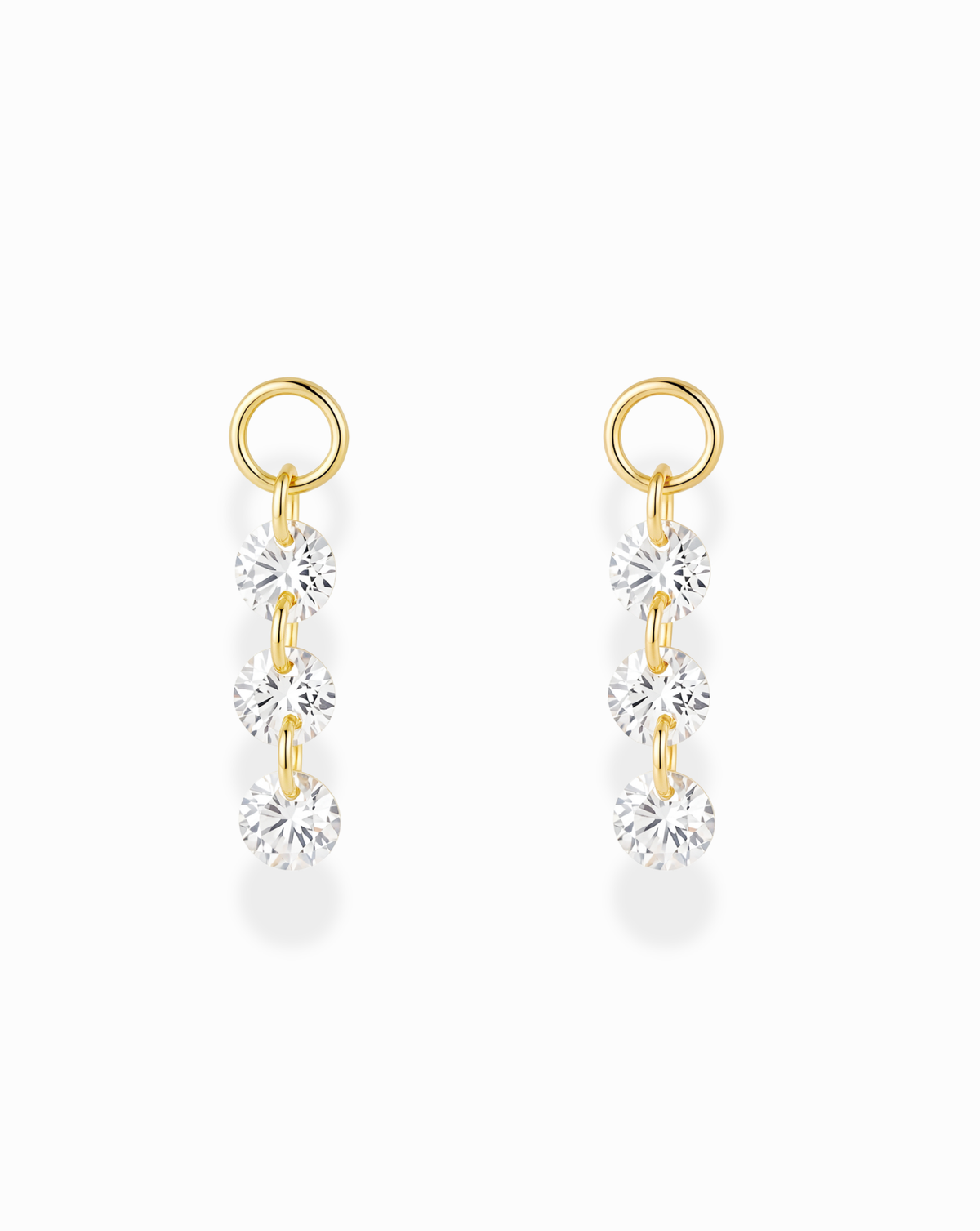 Mod + Jo Sade Sapphire Earring Charms featuring a pair of gold-plated hoop charms, each set with three vertical, round-cut lab-grown white sapphire stones.