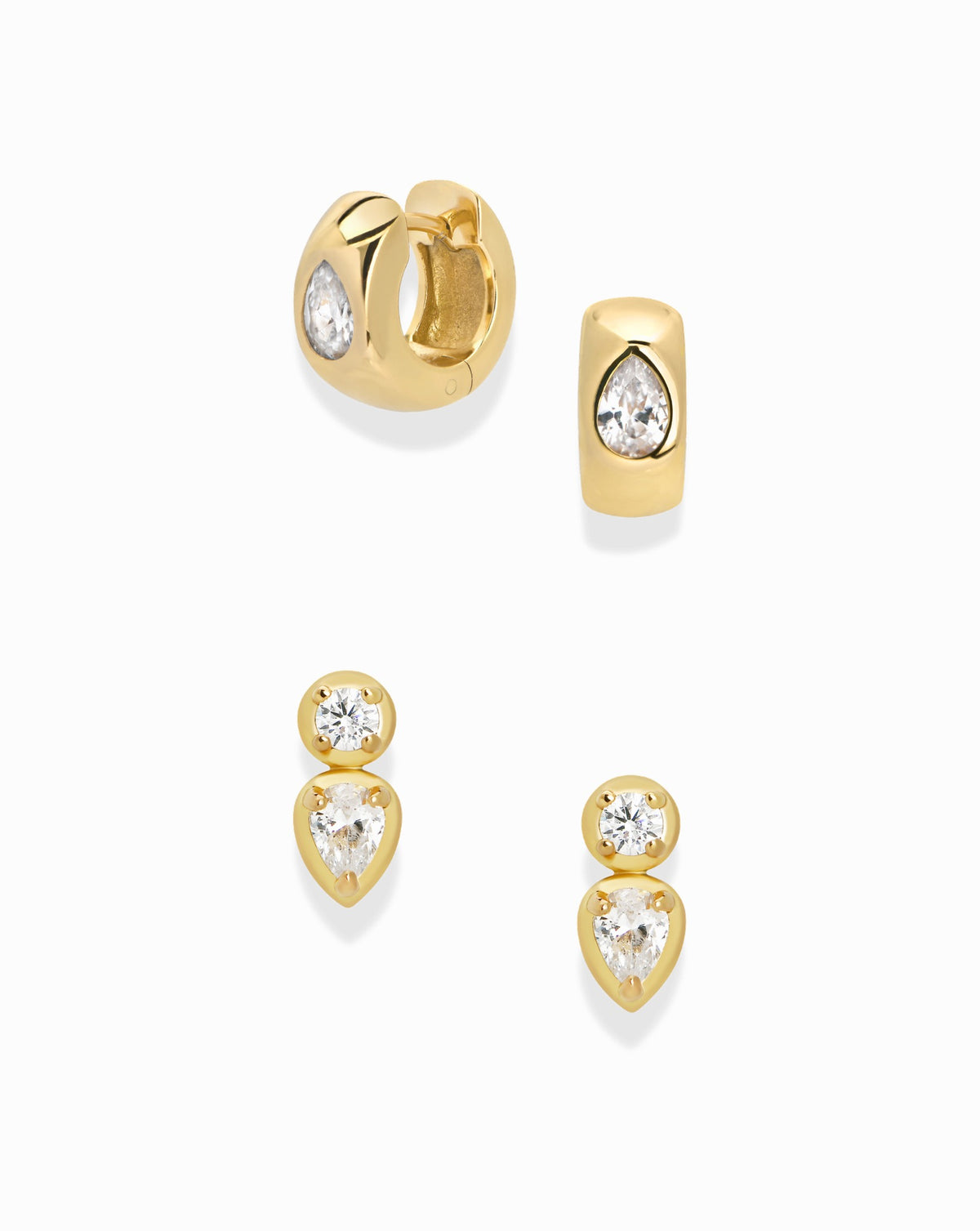 The Samantha + Raven Set by Mod + Jo includes two gold huggie earrings with bezel-set pear stones and two gold stacked stud earrings, each featuring a round stone above a pear-shaped stone.