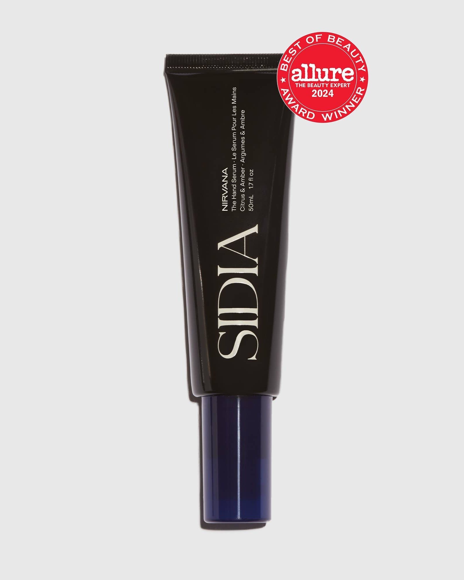 Black skincare tube with &#39;SIDIA&#39; branding and &#39;Allure&#39; award badge on a light gray background