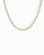Gold ball chain necklace on a white background