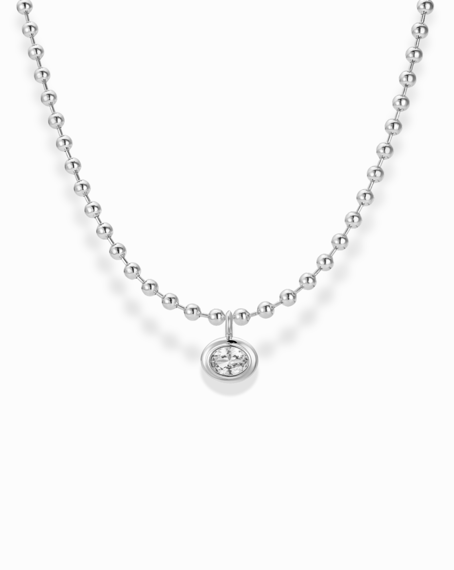 The Soren Bezel Pendant Necklace is a silver beaded necklace with a round pendant featuring a single lab-grown white sapphire, displayed on a white background.