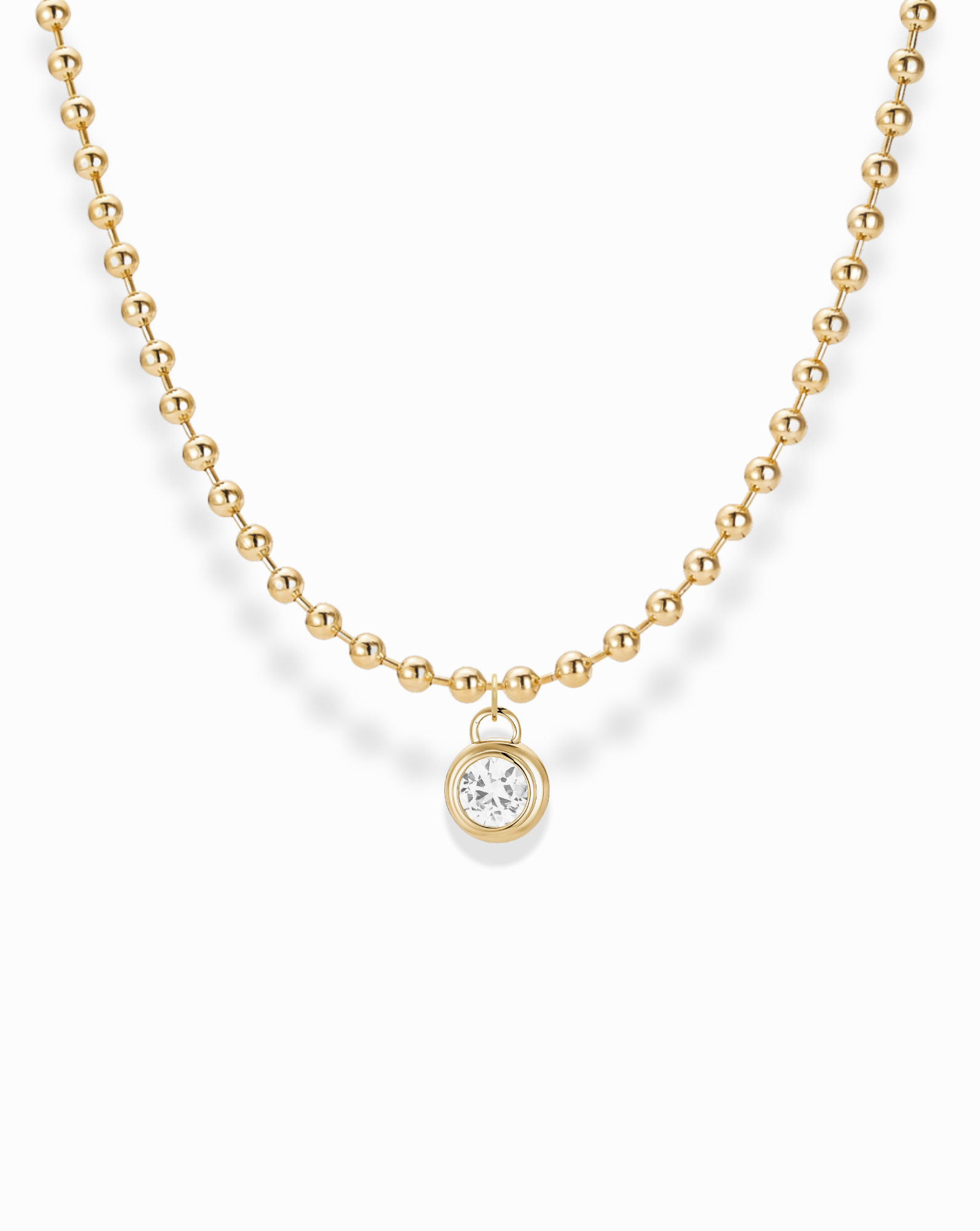 The Soren Bezel Pendant Necklace features a single round, lab-grown white sapphire set in a 14k gold-plated, nickel-free beaded chain, displayed against a white background.