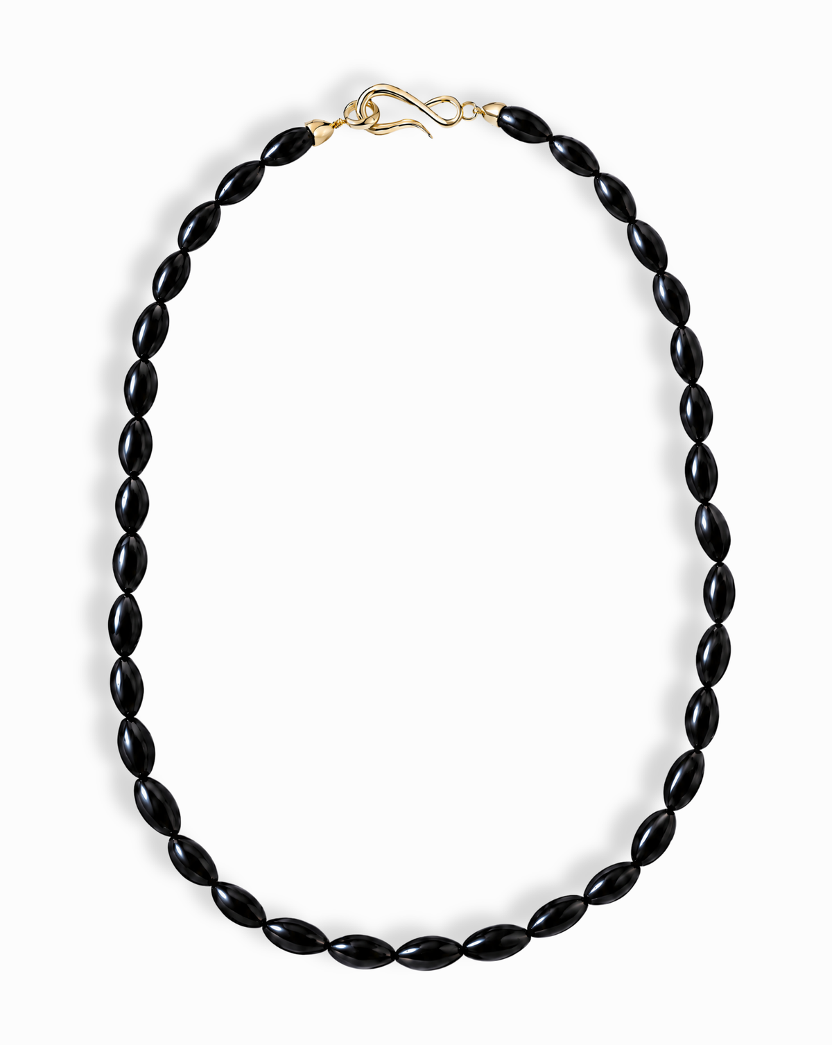Sutton Gemstone Necklace featuring an 18-inch strand of oval, rice-shaped black agate beads with a gold S-hook clasp.