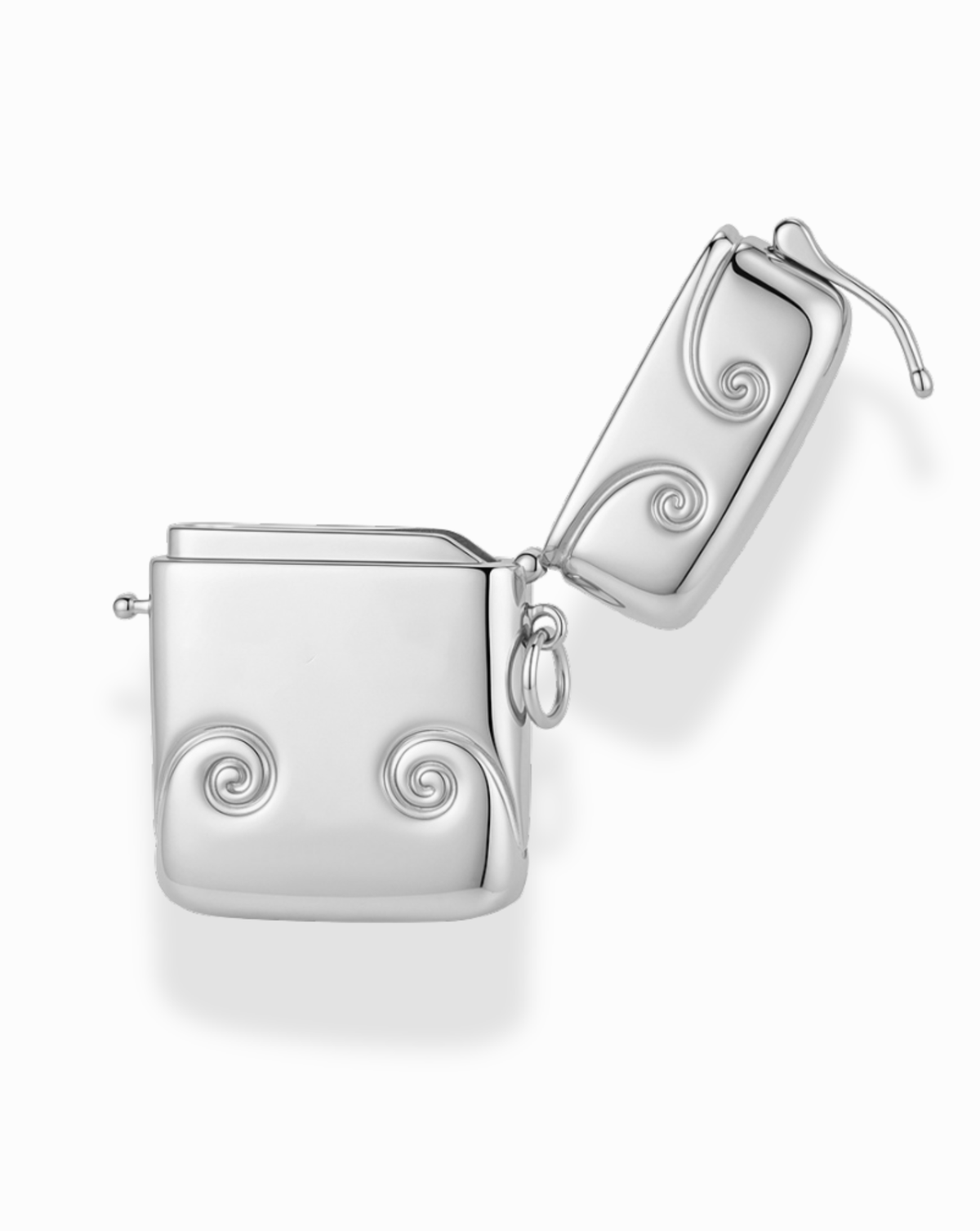 Sybil Vesta Case charm, a small silver-plated Victorian-style open rectangular case decorated with embossed swirls on the front and lid.